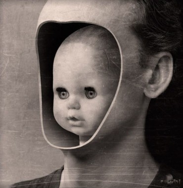 scary baby doll inside of a man's face