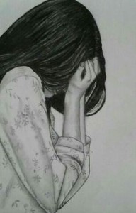 Broken hearted girl crying while hiding her face inside her hands