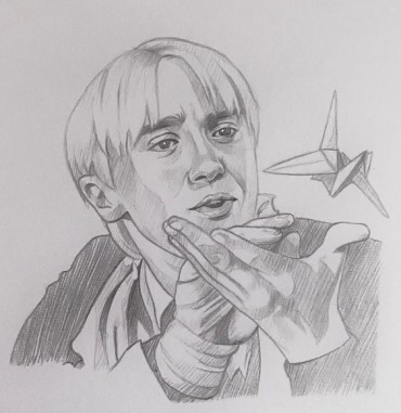 Drawing of Draco Malfoy  playing with a flying origami paper