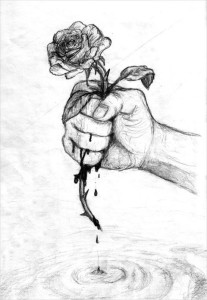 A hand holding a rose bleeding