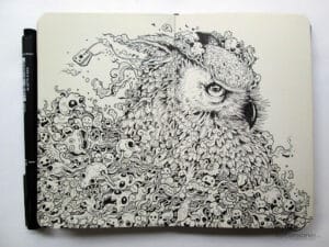 detailed owl doodle drawing in a sketchbook