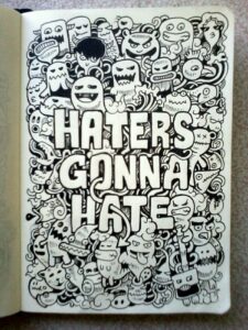 doodles surrounding the words : A haters gonna hate