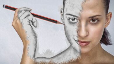 a girl holding a pencil and drawing her face to prove anyone can learn how to draw
