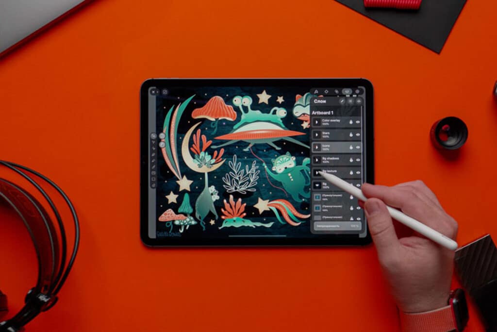 someone drawing with an apple pencil using a free iPad drawing app : Vectornator: Design Software